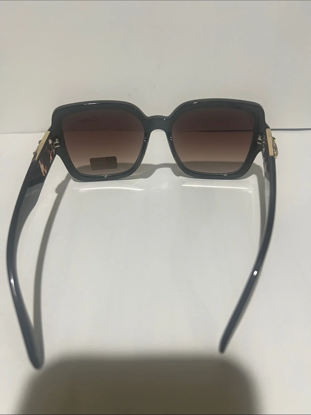 Cartier Women's Black Frame Sunglasses with Brown Gradient Lenses